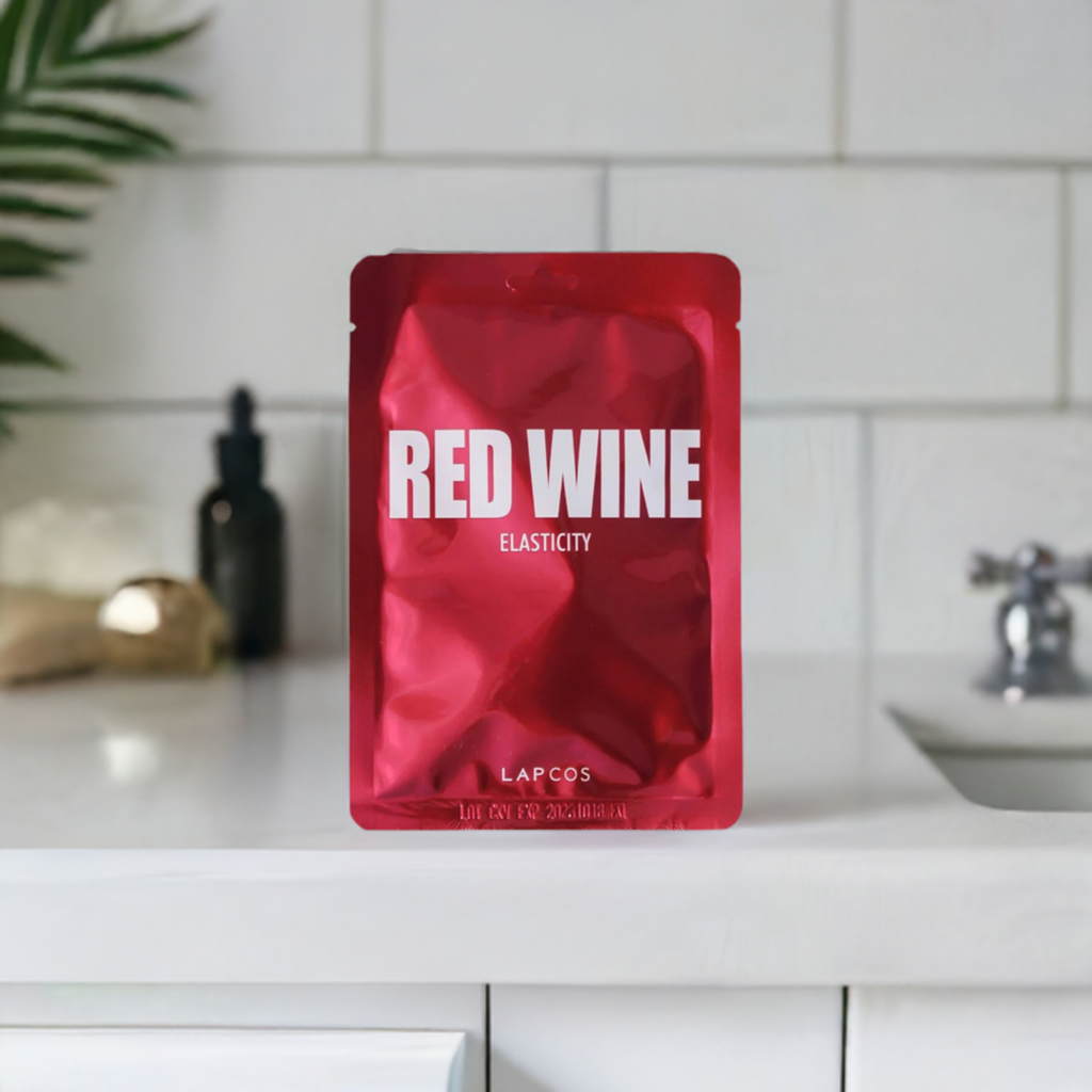 red wine sheet mask on a bathroom counter 