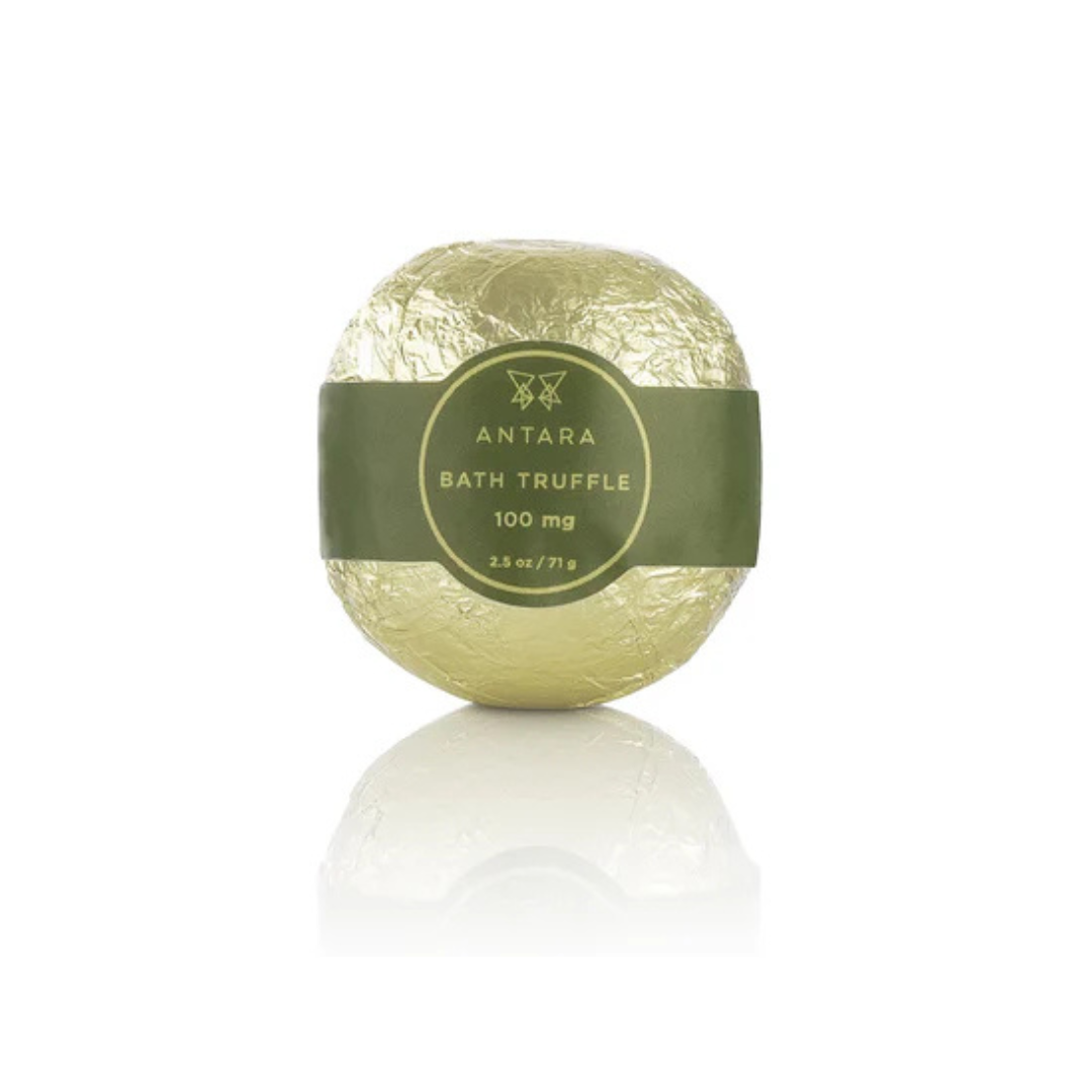 single antara bath truffle, wrapped in gold foil with green band around it - with 100 mg of cbd available at heaven on earth aspen 