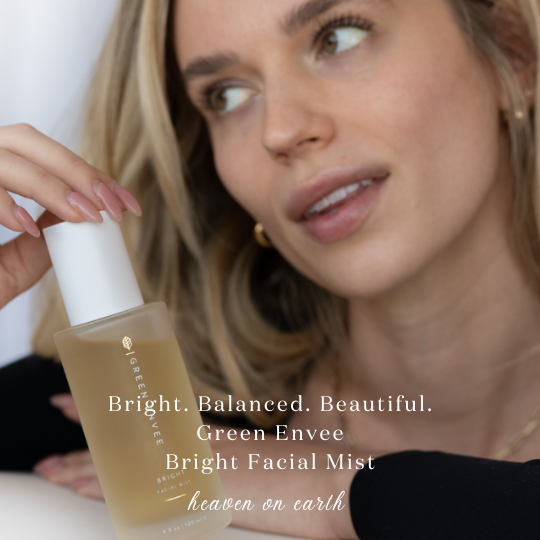 model holding the green envee bright facial mist with the caption: &quot;bright. balanced. beautiful - Green envee bright facial mist&quot; with the logo &quot;heaven on earth&quot; 