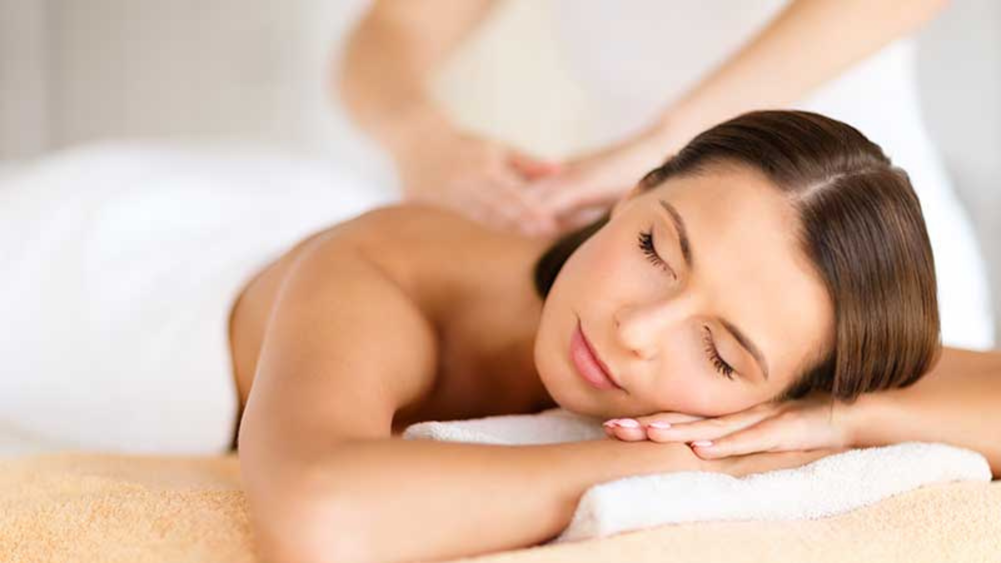 image of woman relaxing while having a massage 