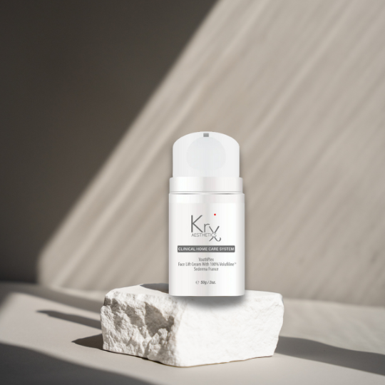 bottle of the youthplex face lift cream on a white stone. 