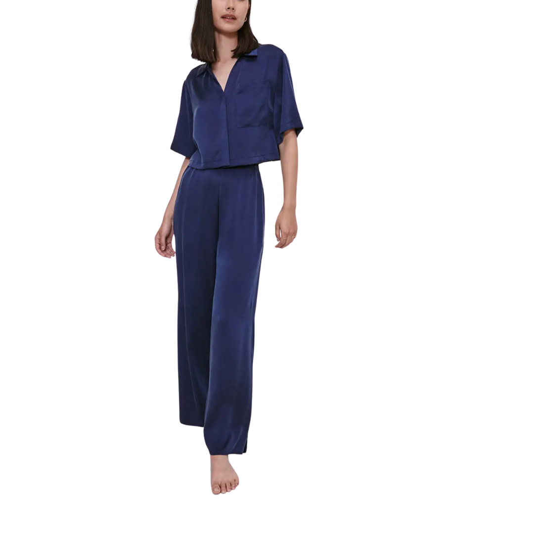 model wearing the lunya washable silk high rise pant set in deep blue sold at heaven on earth