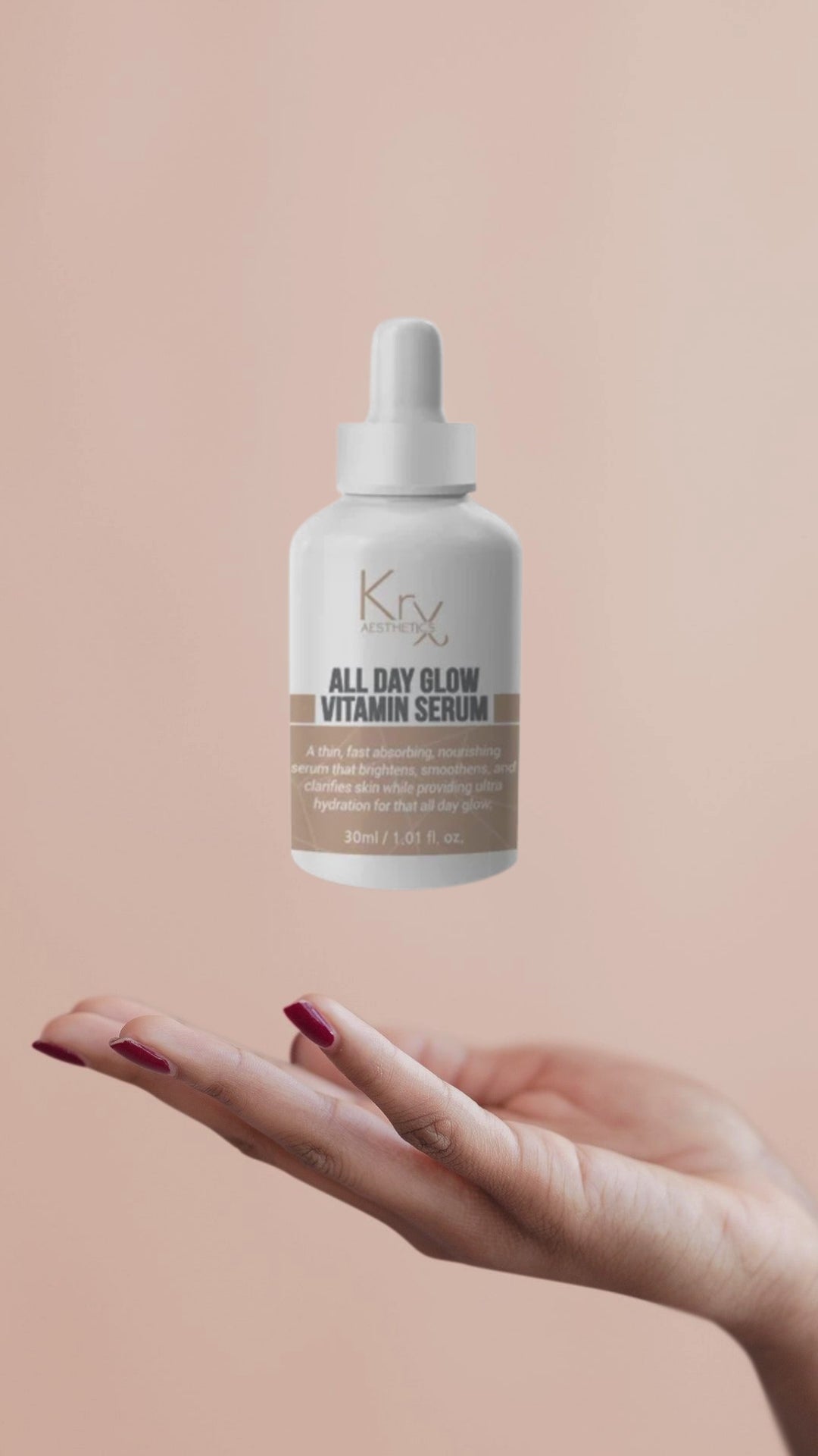 video of the krx aesthetics all day glow vitamin serum in suspension over a hand